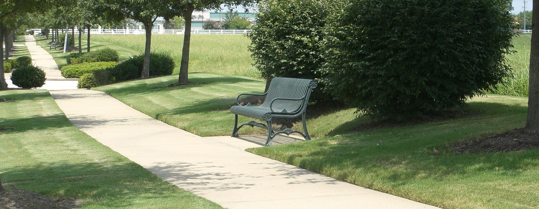 rolling hills, walkways and a bench in nearby neighborhood